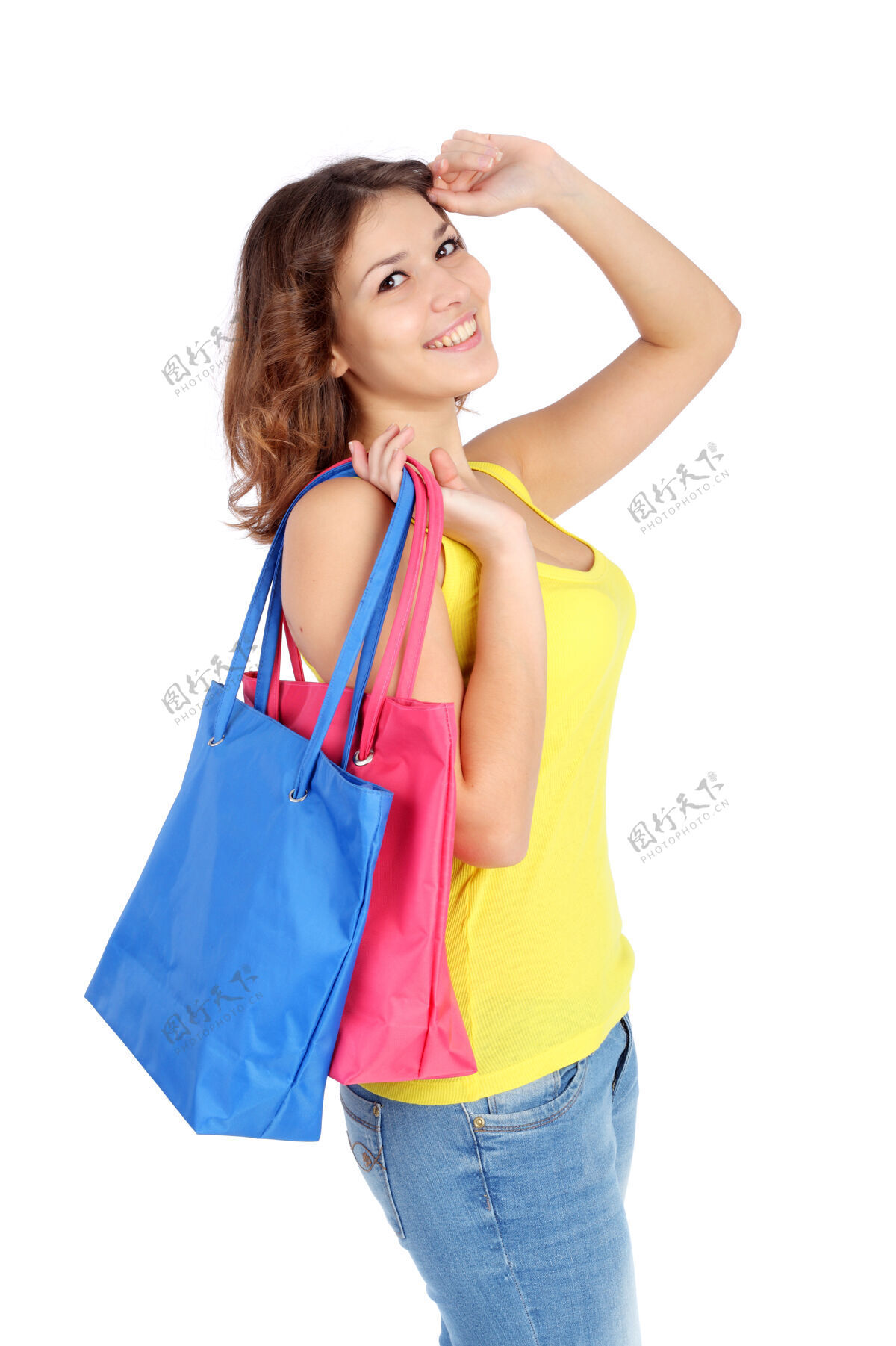 享受带着购物袋的漂亮女孩顾客购买包